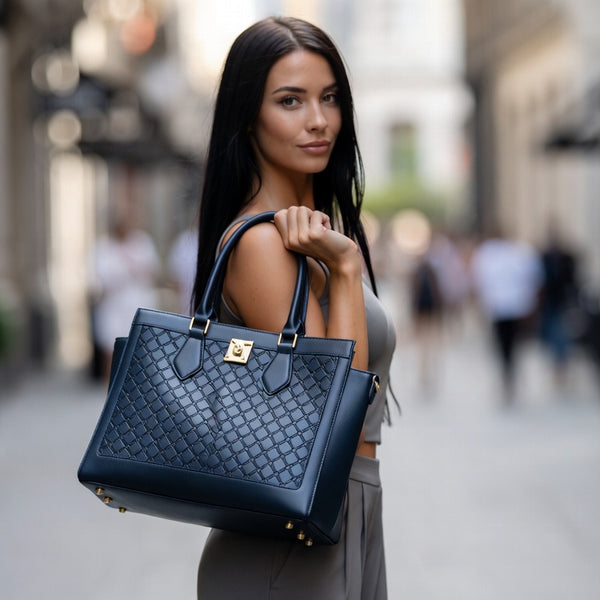Woman holding a blue handbag on a city street